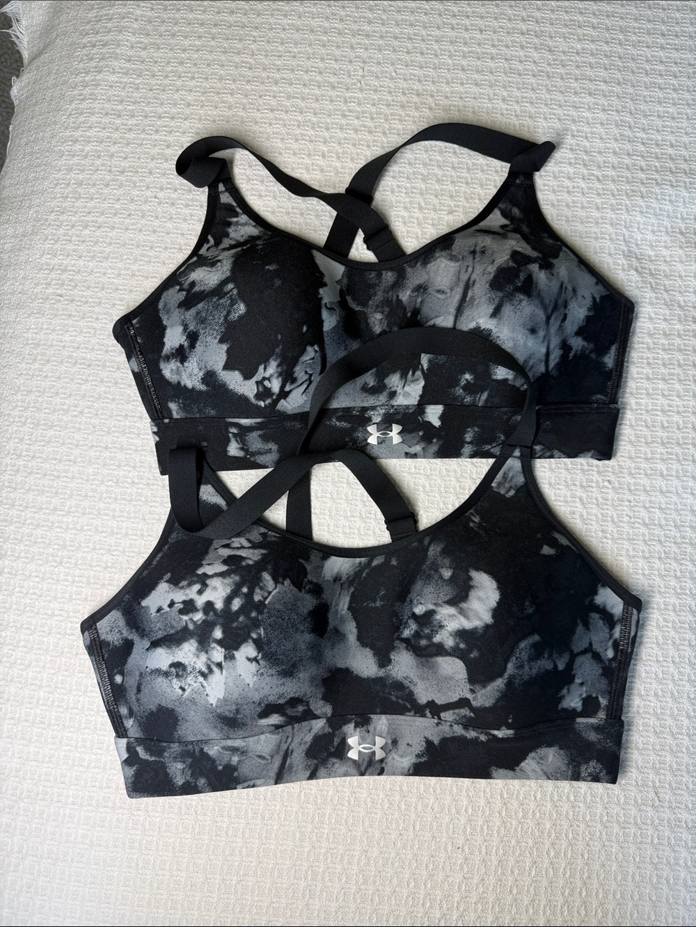 Under Armour sports bras size medium with molded brac cups and adjustable straps